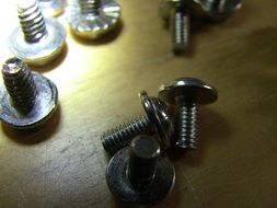 metal shiny bolts on the table