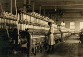 vintage photo, child girl working on textile mill