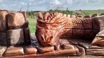 wooden dragon figurines in a park