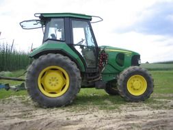 green tractor in countryside