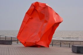 abstract red cube on the promenade