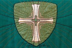 cross on green cloth