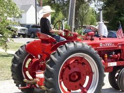 farmer on a red tractor