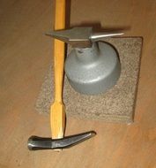 hammer and anvil on the table in the workshop