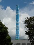chimney industrial plant on the background of the cloudy sky