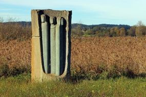 abstract modern stone sculpture in countryside