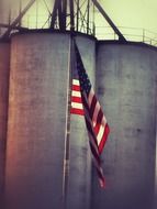 american flag on an industrial building