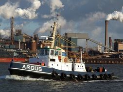 tugboat speeding at harbor