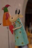 decorative figure of a cow in a dress