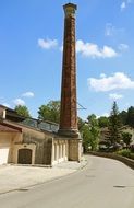 High brick chimney on the factory
