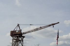 crane machine on a factory and cloudy sky