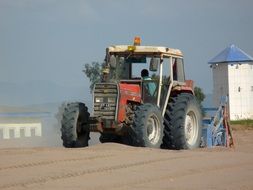 tractor on a sandy beach