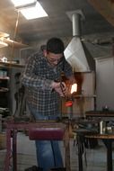young glassblower at work