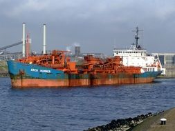 Ship Arco Humber on the bsckground of marine industry