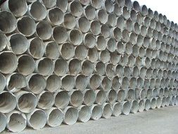 metal pipes stacked on top of each other