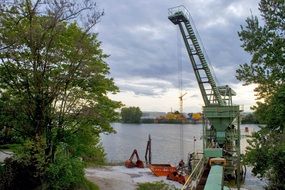 Industrial crane functioning on the Rhine river