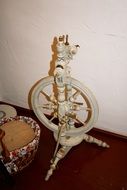 Old spinning wheel made of wood