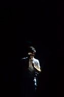 Man ring a song in dark space
