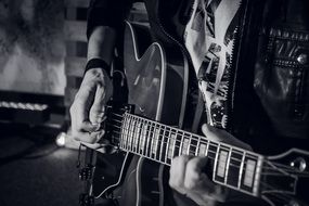 black and white photo of guitar player
