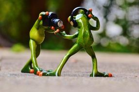 frogs with headphones dancing and posing