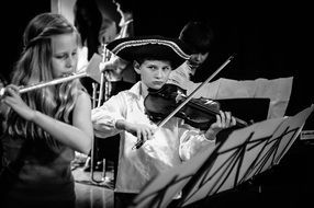 Black and white photo of the concert of young musicians