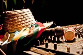 straw hat on DJ's remote