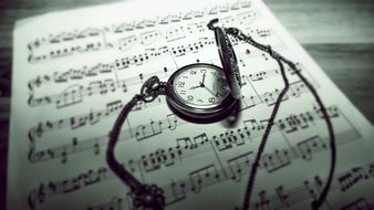 pocket watch on note sheet