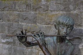 flute player statue