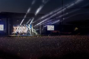 bright concert stage and many people