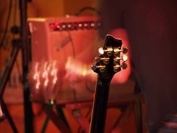 headstock of electric guitar in studio