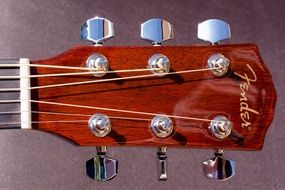wooden head of acoustic guitar