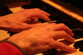 hands on church organ keys