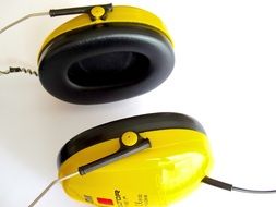 yellow headphones on a white background