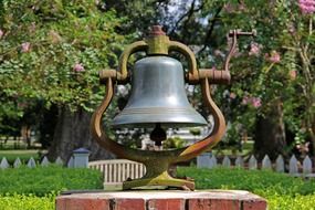 vintage railroad bell in garden