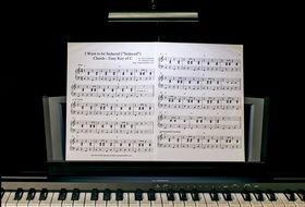 piano Yamaha and music notebook