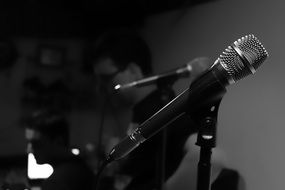 microphones and guitarist in a recording studio