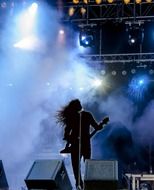 rock singer with guitar on stage