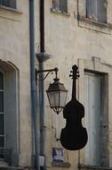 street sign of violin on wall