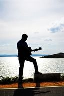 guitarist silhouette sunset