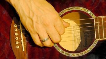 close-up guitar playing