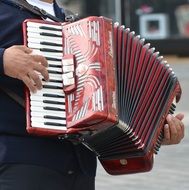man plays the accordion