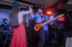 couple of musicians on a small stage