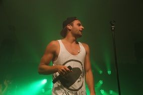man with microphone on concert