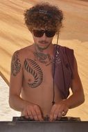 music dj with tattoo