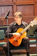guitar player on stage at a concert