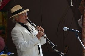 adult man playing clarinet