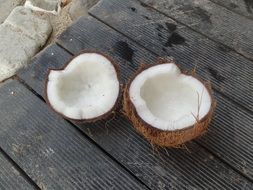 broken coconut on a wooden surface