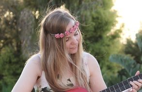 girl plaing a guitar music