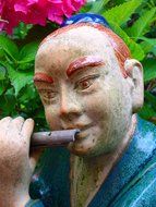 flautist asian musician statue