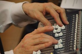 hands on the mixer close-up